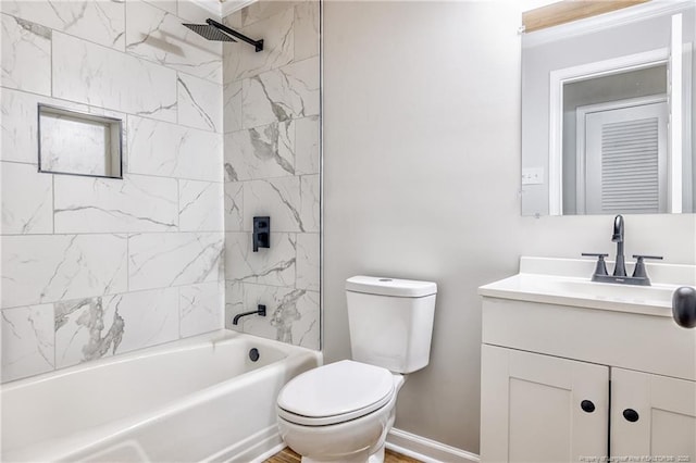 bathroom with baseboards,  shower combination, toilet, and vanity