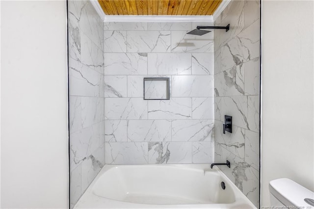 bathroom featuring toilet, shower / tub combination, and crown molding