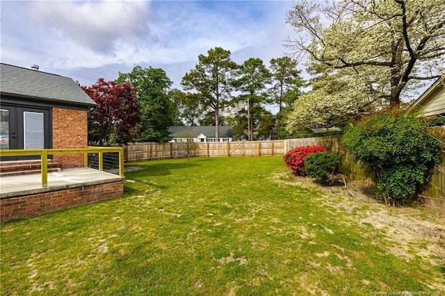 view of yard with a fenced backyard and a patio area