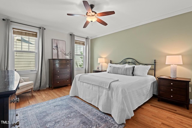 997 Windy Rd, Apex, NC 27502 - bedroom with light wood-style floors, ornamental molding, and ceiling fan