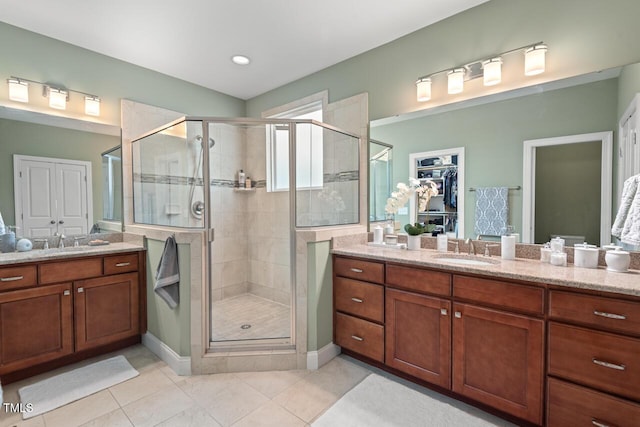 997 Windy Rd, Apex, NC 27502 - bathroom with a shower stall, vanity, tile patterned floors, and a spacious closet