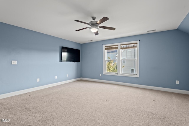 997 Windy Rd, Apex, NC 27502 - empty room featuring a ceiling fan, carpet flooring, and vaulted ceiling