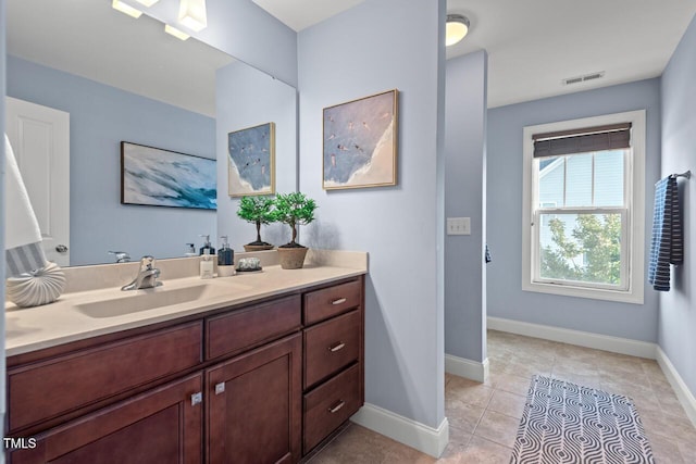 997 Windy Rd, Apex, NC 27502 - bathroom featuring vanity and tile patterned floors