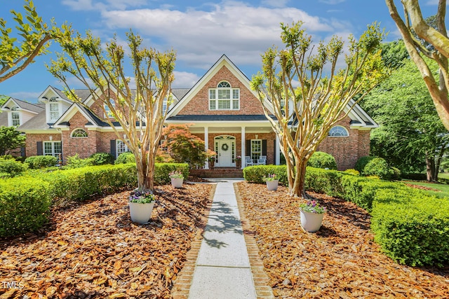 129 Trellingwood Dr, Morrisville, NC 27560 - view of front facade featuring brick siding and covered porch