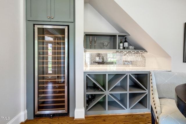 129 Trellingwood Dr, Morrisville, NC 27560 - indoor dry bar featuring beverage cooler and wood finished floors
