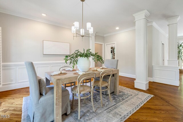 129 Trellingwood Dr, Morrisville, NC 27560 - dining room featuring ornate columns, crown molding, wood finished floors, recessed lighting, and a chandelier