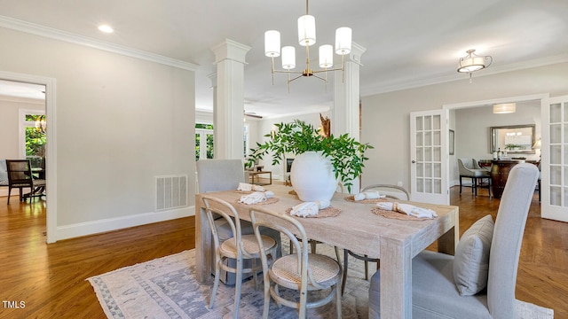 129 Trellingwood Dr, Morrisville, NC 27560 - dining space featuring crown molding, french doors, wood finished floors, a chandelier, and baseboards