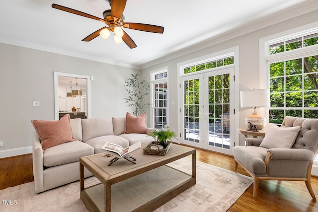 129 Trellingwood Dr, Morrisville, NC 27560 - living area featuring ornamental molding, a ceiling fan, light wood-style floors, french doors, and baseboards