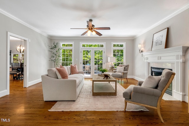129 Trellingwood Dr, Morrisville, NC 27560 - living area featuring a ceiling fan, crown molding, a fireplace, french doors, and wood finished floors