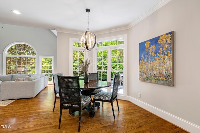 129 Trellingwood Dr, Morrisville, NC 27560 - dining room with a chandelier, ornamental molding, baseboards, wood finished floors, and recessed lighting