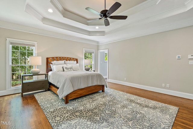 129 Trellingwood Dr, Morrisville, NC 27560 - bedroom featuring wood finished floors, crown molding, baseboards, a raised ceiling, and a ceiling fan