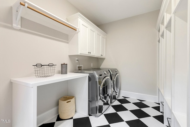 129 Trellingwood Dr, Morrisville, NC 27560 - laundry room with light floors, cabinet space, washing machine and clothes dryer, and baseboards