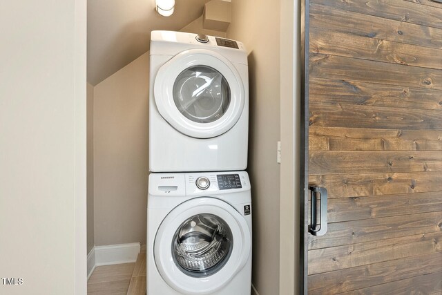129 Trellingwood Dr, Morrisville, NC 27560 - washroom featuring stacked washing machine and dryer and baseboards