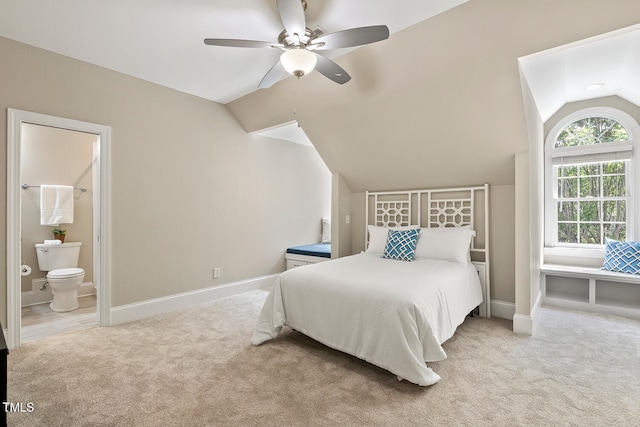 129 Trellingwood Dr, Morrisville, NC 27560 - carpeted bedroom featuring vaulted ceiling, baseboards, connected bathroom, and ceiling fan