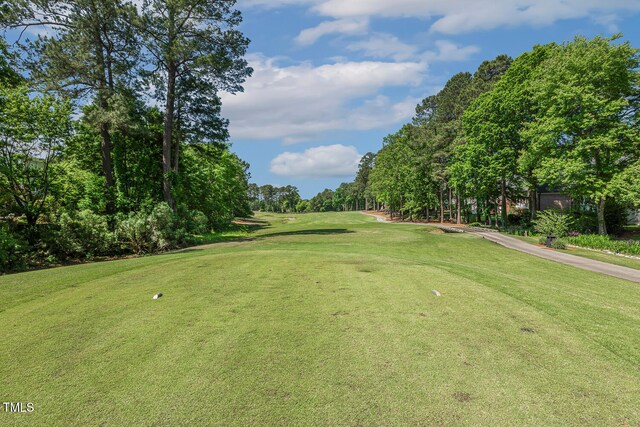 129 Trellingwood Dr, Morrisville, NC 27560 - view of home's community with view of wooded area, golf course view, and a lawn