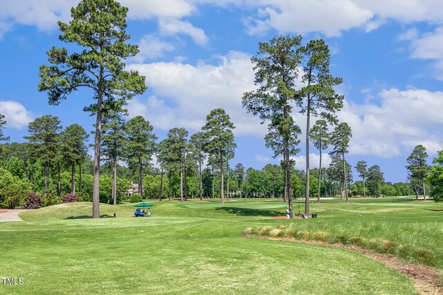 129 Trellingwood Dr, Morrisville, NC 27560 - view of community featuring view of wooded area, view of golf course, and a yard