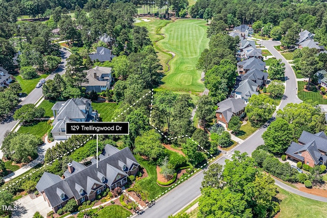 129 Trellingwood Dr, Morrisville, NC 27560 - aerial overview of property's location featuring nearby suburban area, a golf course, and a tree filled landscape