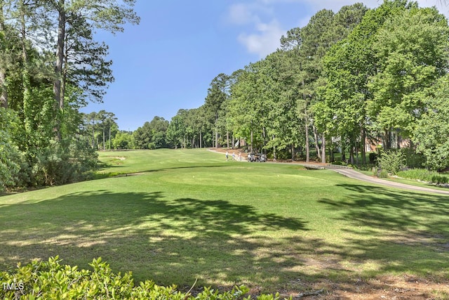 129 Trellingwood Dr, Morrisville, NC 27560 - surrounding community featuring view of scattered trees, view of golf course, and a yard