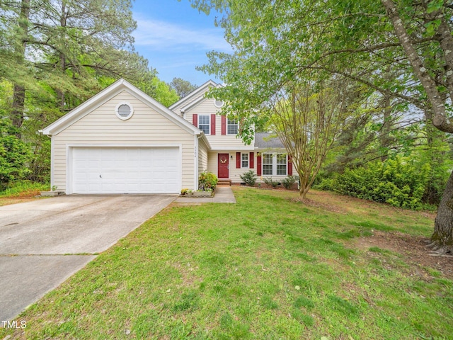 5504 Cumberland Plain Dr, Raleigh, NC 27616 - traditional-style house featuring an attached garage, a front lawn, and concrete driveway