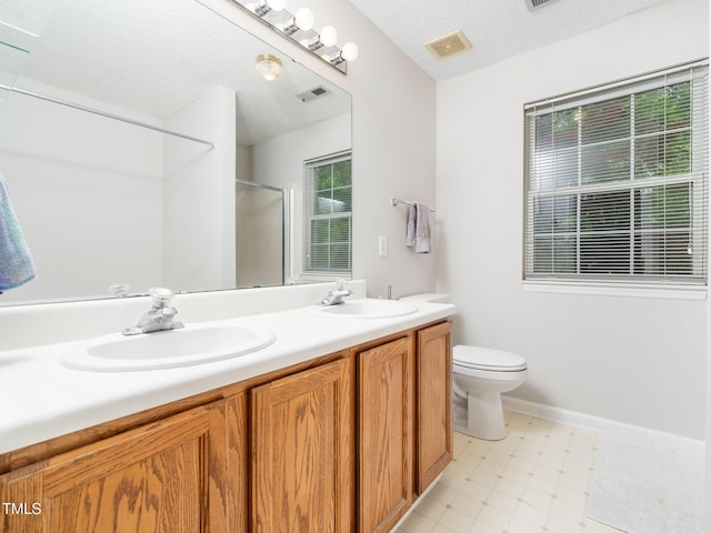 5504 Cumberland Plain Dr, Raleigh, NC 27616 - full bathroom featuring a shower with shower door, visible vents, toilet, and a sink