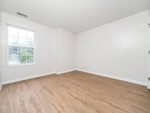 5504 Cumberland Plain Dr, Raleigh, NC 27616 - empty room featuring light wood-style flooring, visible vents, and baseboards