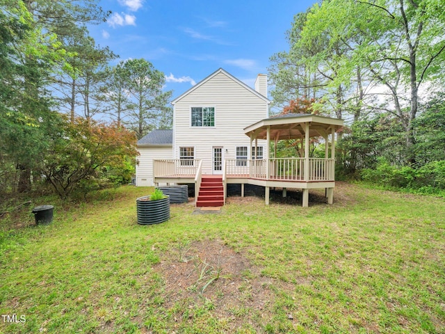 5504 Cumberland Plain Dr, Raleigh, NC 27616 - rear view of property featuring a lawn, a wooden deck, a gazebo, and a chimney