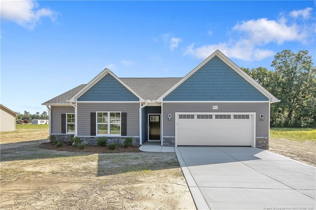 4915 High Branch Ct, Stedman, NC 28391 - craftsman-style home with stone siding, an attached garage, and concrete driveway
