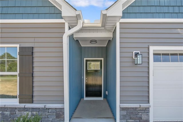 4915 High Branch Ct, Stedman, NC 28391 - view of exterior entry featuring stone siding and a garage