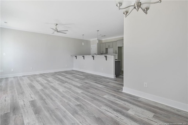 4915 High Branch Ct, Stedman, NC 28391 - unfurnished living room with ceiling fan, a chandelier, and light wood-style flooring