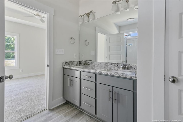 4915 High Branch Ct, Stedman, NC 28391 - bathroom featuring double vanity, ceiling fan, and wood finished floors