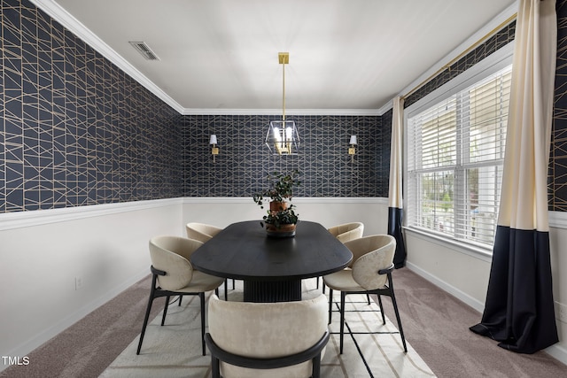 carpeted dining area featuring crown molding, visible vents, wallpapered walls, and baseboards
