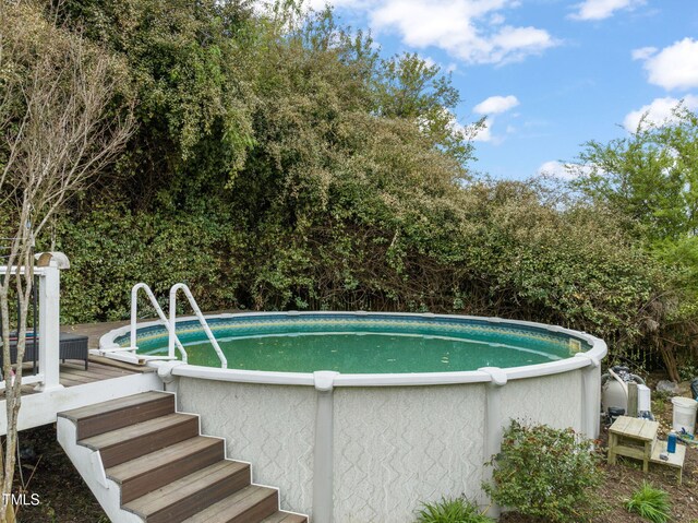 8437 Little Woody Ct, Zebulon, NC 27597 - outdoor pool with a wooden deck