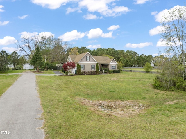 8437 Little Woody Ct, Zebulon, NC 27597 - view of front facade featuring fence and a front lawn