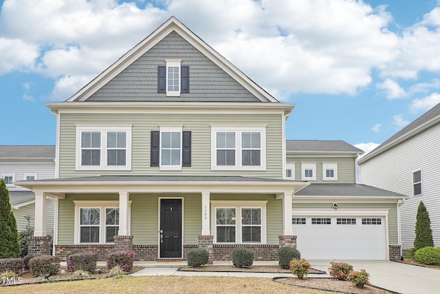 view of front of house with brick siding, a porch, concrete driveway, and a garage