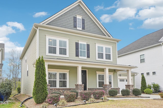 view of front of property with covered porch and brick siding