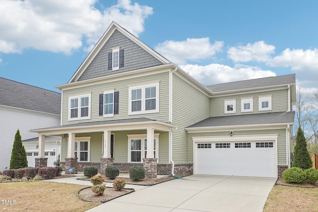 view of front of home featuring driveway, covered porch, a garage, and brick siding
