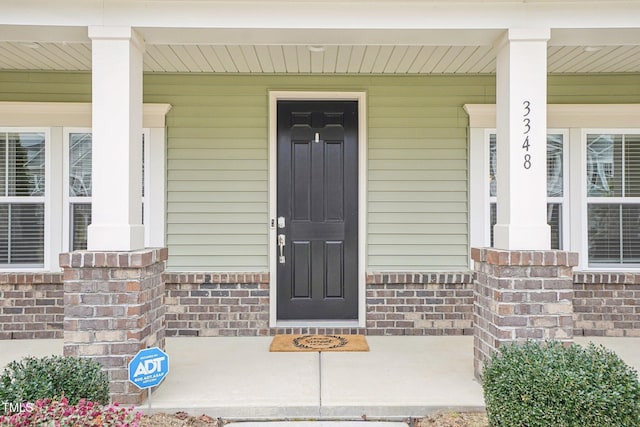 property entrance featuring covered porch