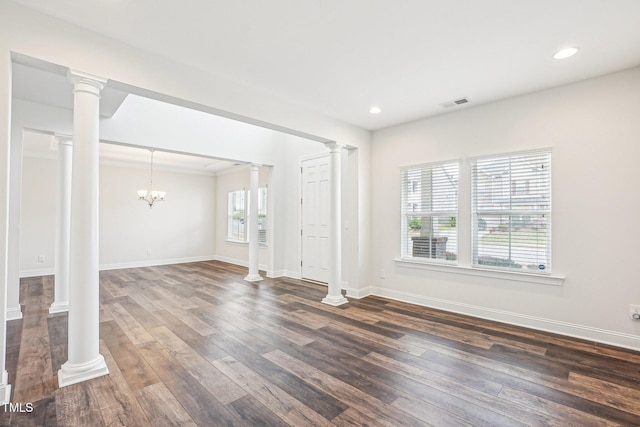 unfurnished living room featuring dark wood-type flooring, baseboards, a chandelier, and recessed lighting
