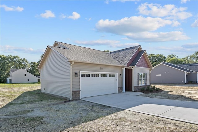 4905 High Branch Ct, Stedman, NC 28391 - view of front facade featuring an attached garage, stone siding, driveway, and a shingled roof