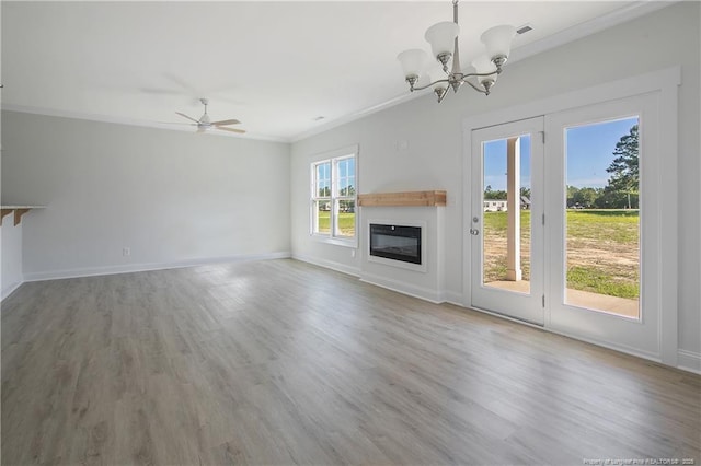 4905 High Branch Ct, Stedman, NC 28391 - unfurnished living room with ornamental molding, a glass covered fireplace, a chandelier, wood finished floors, and ceiling fan