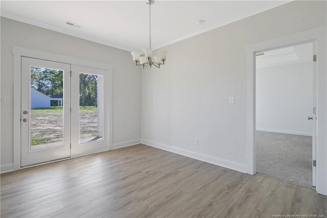 4905 High Branch Ct, Stedman, NC 28391 - empty room featuring a chandelier, wood finished floors, and crown molding