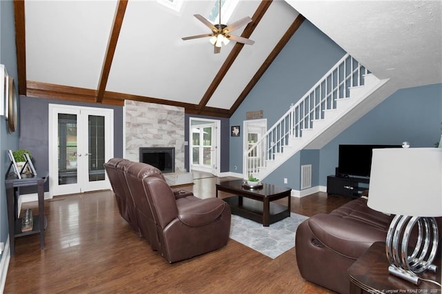 6868 Uppingham Rd, Fayetteville, NC 28306 - living room featuring high vaulted ceiling, a ceiling fan, baseboards, wood finished floors, and stairway