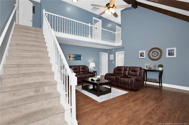 6868 Uppingham Rd, Fayetteville, NC 28306 - living room featuring ceiling fan, high vaulted ceiling, stairs, wood finished floors, and beamed ceiling