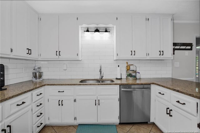 6868 Uppingham Rd, Fayetteville, NC 28306 - kitchen featuring white cabinets, a sink, dishwasher, dark stone countertops, and decorative backsplash