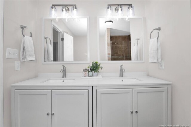 6868 Uppingham Rd, Fayetteville, NC 28306 - bathroom featuring double vanity, a sink, and a shower