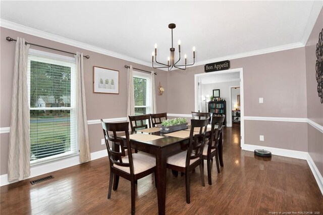 6868 Uppingham Rd, Fayetteville, NC 28306 - dining room with baseboards, wood finished floors, a notable chandelier, and visible vents