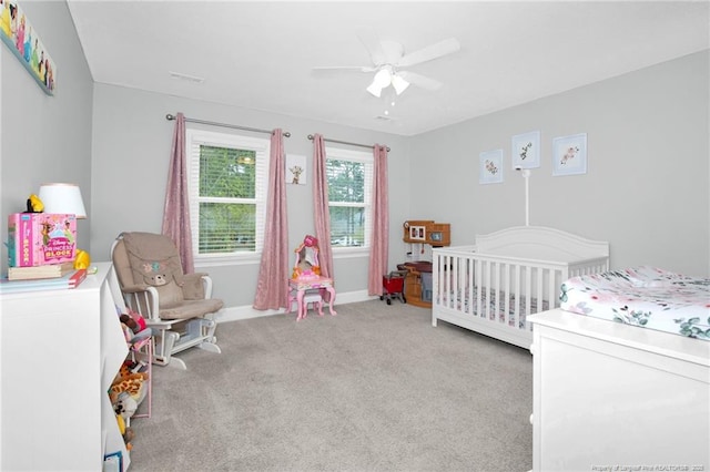 6868 Uppingham Rd, Fayetteville, NC 28306 - bedroom with light colored carpet, a ceiling fan, baseboards, and a nursery area