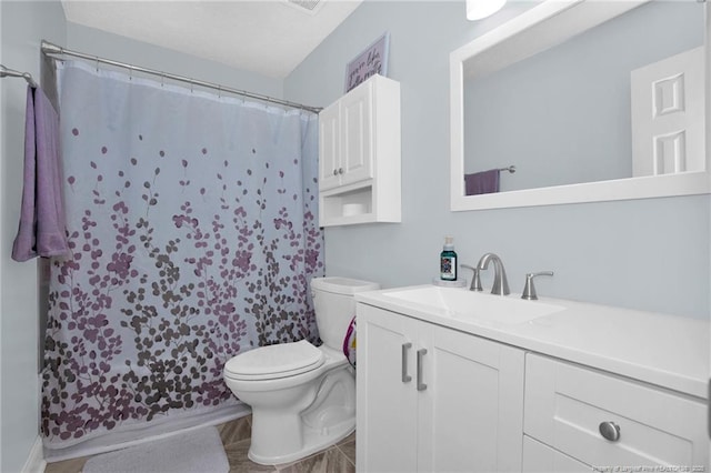6868 Uppingham Rd, Fayetteville, NC 28306 - bathroom featuring vanity, a shower with shower curtain, and toilet