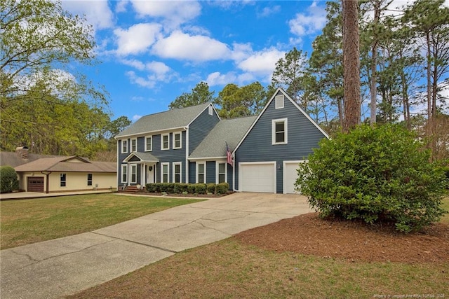 6868 Uppingham Rd, Fayetteville, NC 28306 - colonial home with driveway, a front yard, and a garage