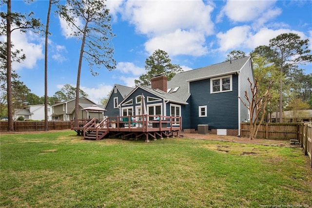 6868 Uppingham Rd, Fayetteville, NC 28306 - back of house with a wooden deck, cooling unit, a fenced backyard, a chimney, and a lawn